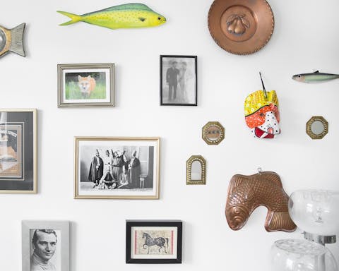This wall full of souvenirs and photos