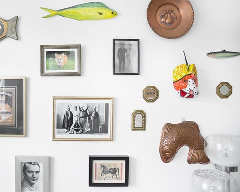 This wall full of souvenirs and photos