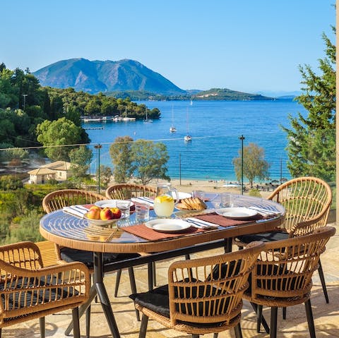 Watch the boats come and go into Spilia Bay over breakfast