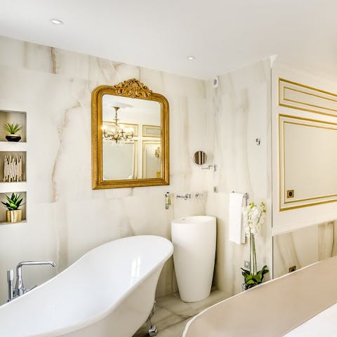 Enjoy a bubble bath in one of the free standing bath tubs