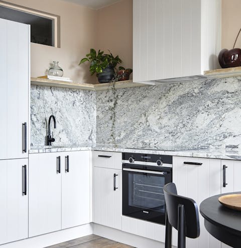 Plate up your smashed avocados in the sleek marble kitchen