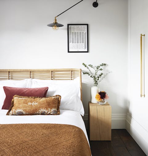Slumber peacefully in luxurious natural fabrics and the wicker bed frame