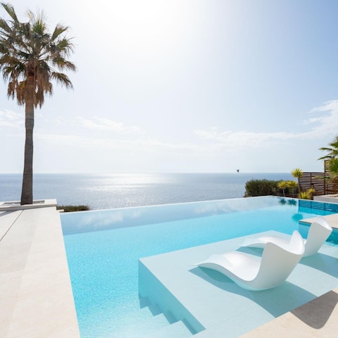 Soak in the private pool as you drink in the sea views