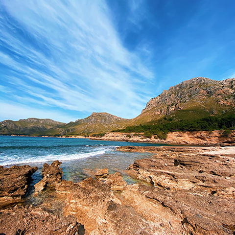 Swim in the sea at Cala Marmassen beach, a sixteen-minute stroll away
