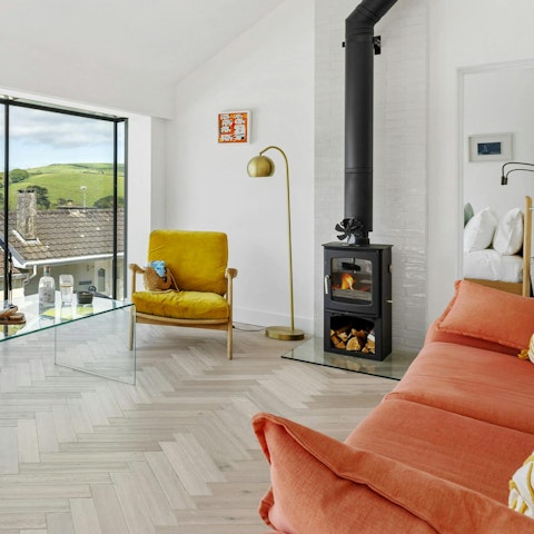 Watch ferries and sailboats drift along the River Dart from the upstairs living space