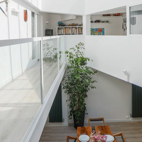 Admire the contemporary high ceilings and glass throughout the house