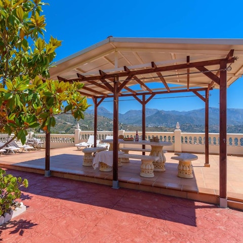 Enjoy a spot of al fresco dining on the shaded terrace