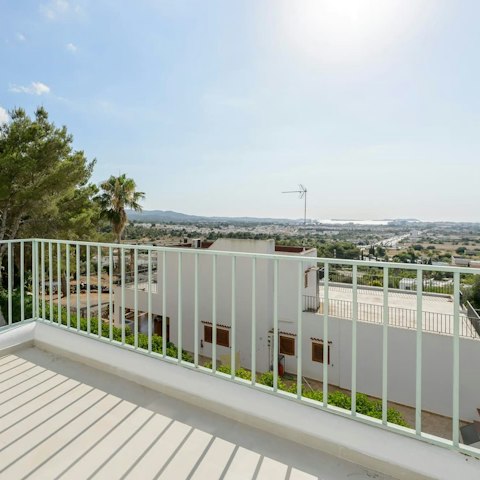 Take in the views from the balcony of the Ibizan countryside