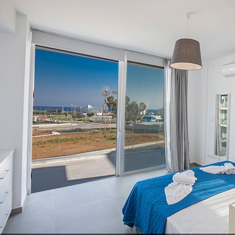 Enjoy a morning cup of coffee on your bedroom's balcony overlooking the pool