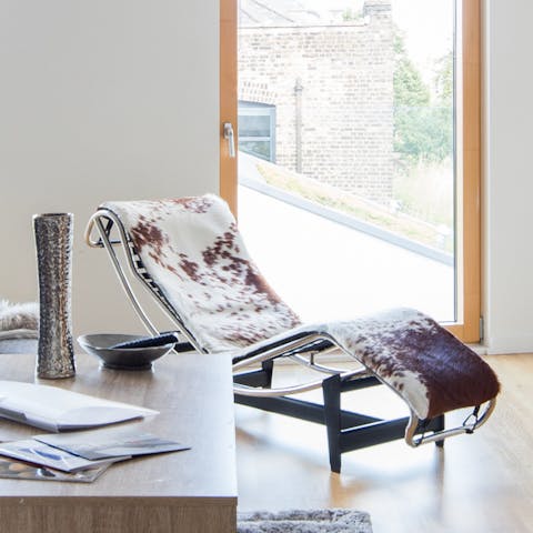Lie back on the Le Corbusier-style cowhide recliner