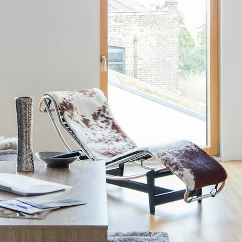 Lie back on the Le Corbusier-style cowhide recliner