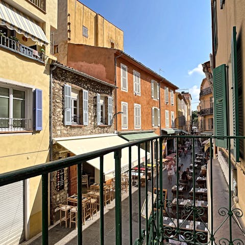 Take in the atmosphere of Antibes' old town from the balcony