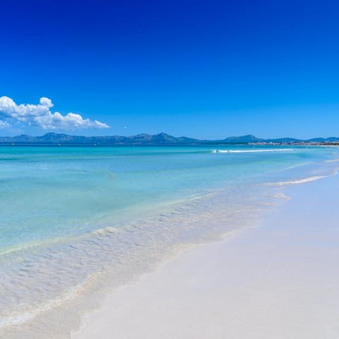 Head to the golden sands of Playa de Muro, just a short drive away