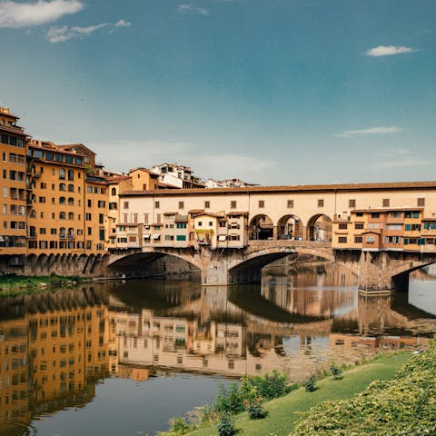 Take a stroll across the Ponte Vecchio to the historic centre