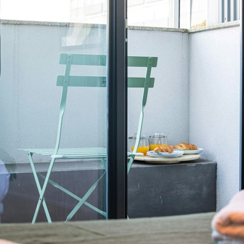 Sip that first coffee of the morning on the balcony