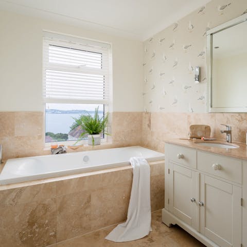 Watch the sun set from the bathtub – glass of something bubbly optional