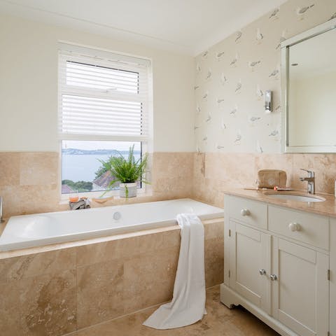 Watch the sun set from the bathtub – glass of something bubbly optional