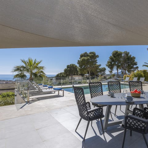 Tuck into an alfresco dinner while admiring coastal views on the horizon