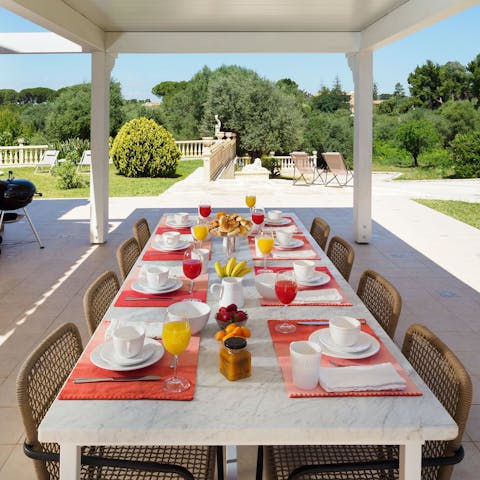 Gather for a shaded alfresco barbecue under the pergola