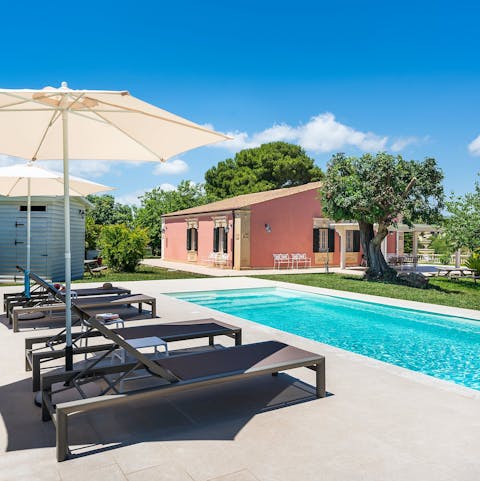 Catch some rays on the loungers or from the waters of the private pool