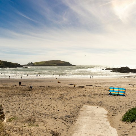 Zip up your wetsuit, grab your board and take the twenty-minute stroll to Bigbury Bitch
