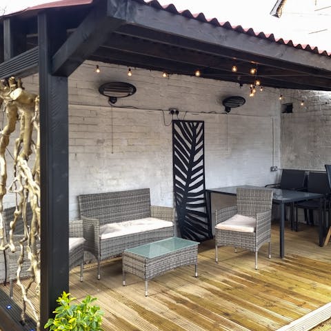 Organise relaxing drinks and barbecue feasts on the elegant patio