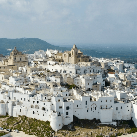 Discover Ostuni's whitewashed old town, twenty-minutes away by car