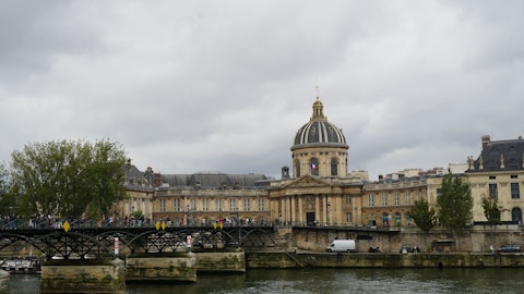 Stroll across Pont des Arts bridge with sweeping Seine views, around six minutes' walk