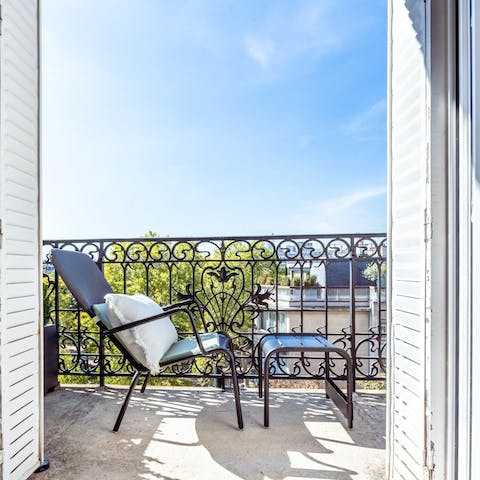 Relax with a glass of Champagne on one of two balconies