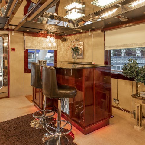 Show off your mixology skills at the mahogany bar