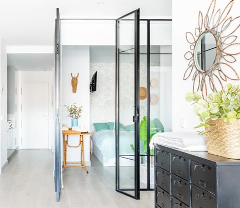 The glass walls of the bedroom