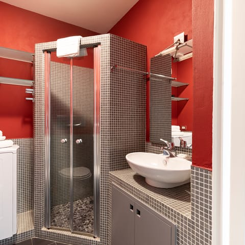 The tiled shower cubicle
