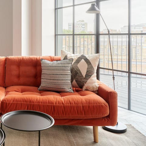 A Mid-century style velvet sofa