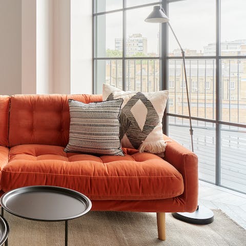 A Mid-century style velvet sofa