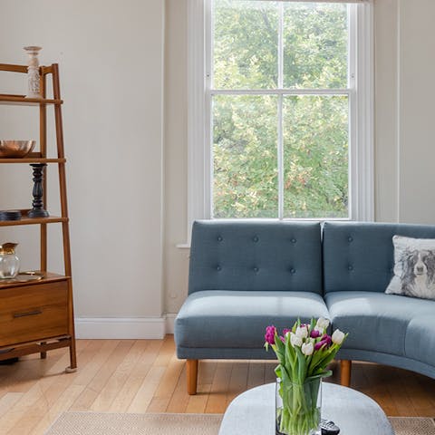 Relax and recline on the corner sofa in the light-filled living room