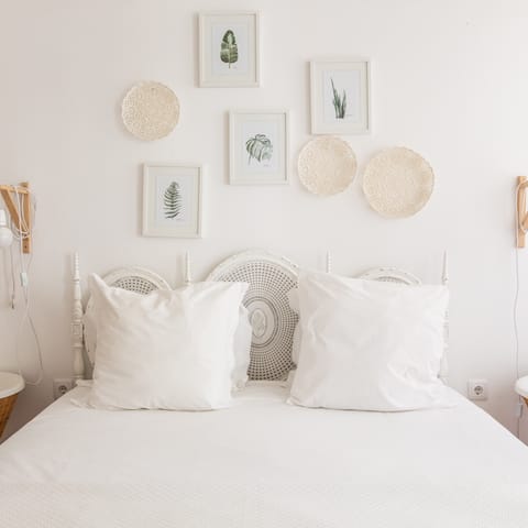Wake up feeling refreshed in the boho chic master bedroom, ready for another day of sightseeing