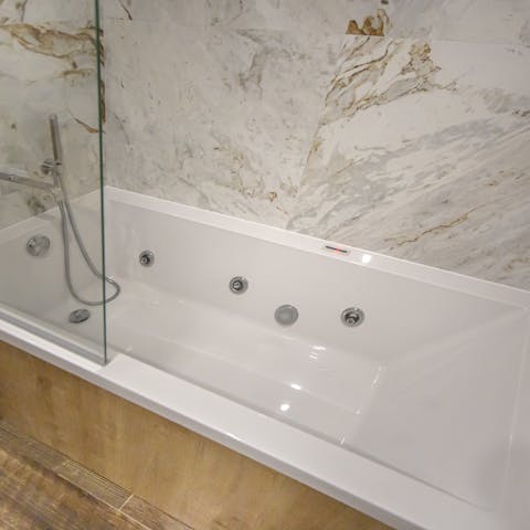 Sink into a hot bath at the end of a busy day and let the Jacuzzi jets soothe your muscles