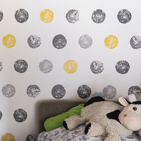 The wallpaper in the child's bedroom