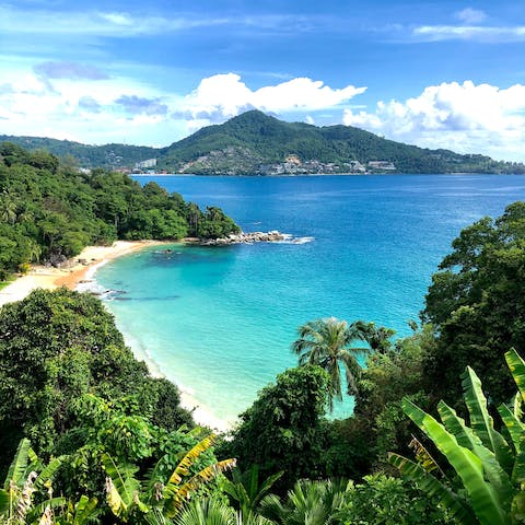 Dip your toes in the crystal waters of Karon Beach, a fifteen-minute walk away