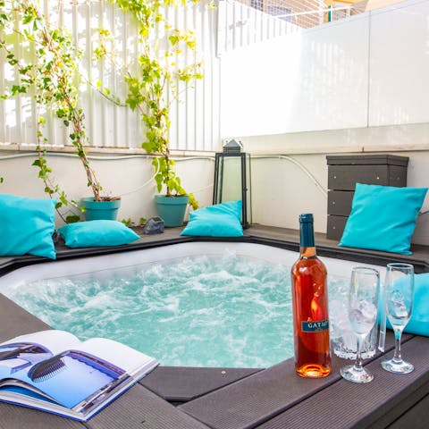 A sunken hot tub with jets