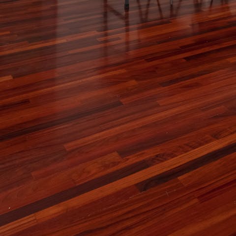 The cherry-red wooden floor