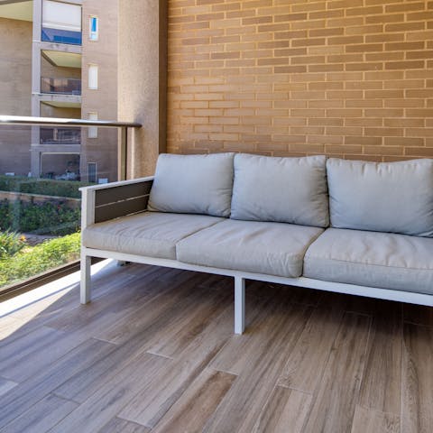 Cosy up on the master's private balcony with your loved one and some sangria