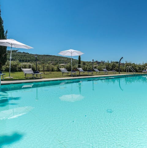 Float in the private pool under Tuscany's clear blue skies