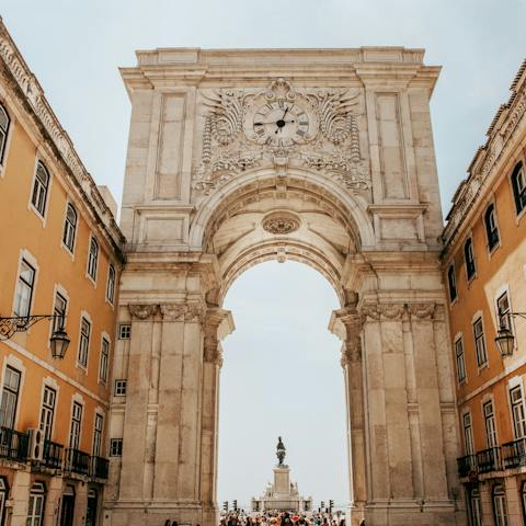 Enter the Praça do Comércio through the triumphal Arco da Rua Augusta – a six-minute walk from your apartment