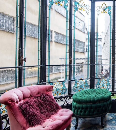 Sip coffee in the stained-glass veranda