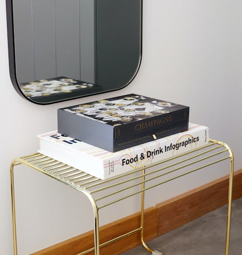Read one of the coffee-table books while you lounge on the bed