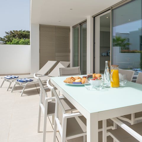 Dig into alfresco Portuguese tomato rice on the private terrace