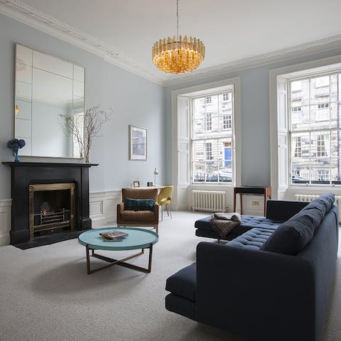 Kick back, relax and admire the period features in the roomy lounge – for extra cosiness, light the fire