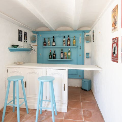 Enjoy a drink at very own bar area