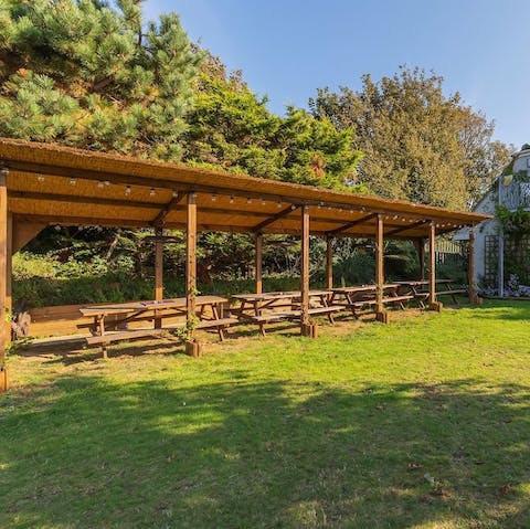 Dine together as a group under the cover of the outdoor seating area